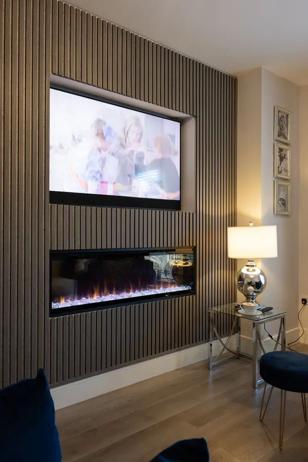 Large TV mounted on a feature wall
